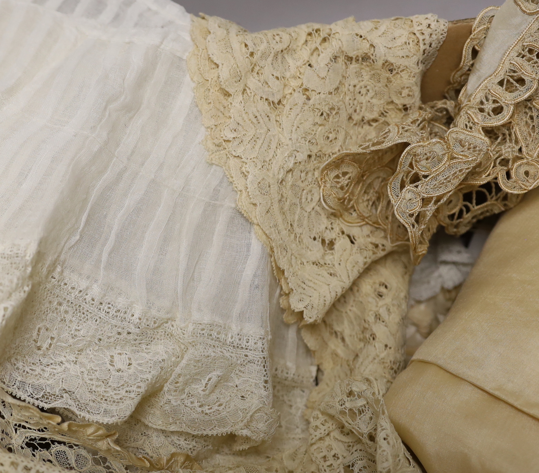 Mixed lace trimmings: a collection of Honiton bobbin lace trimming, a silk tape lace collar, various fine pleated gauze and lace edged trimmings, a silk skirt flounce, etc. A useful collection for making lace garments